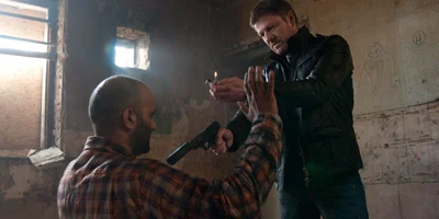Sean Bean Pointing Gun and Holding Lighter Up at Terrorist