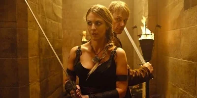 Man and Woman Holding Swords